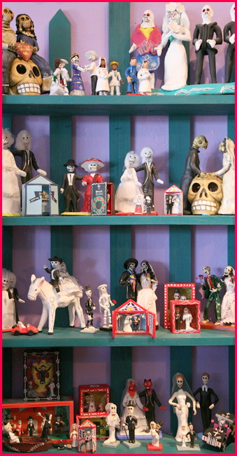 shelf with day of the dead wedding figures